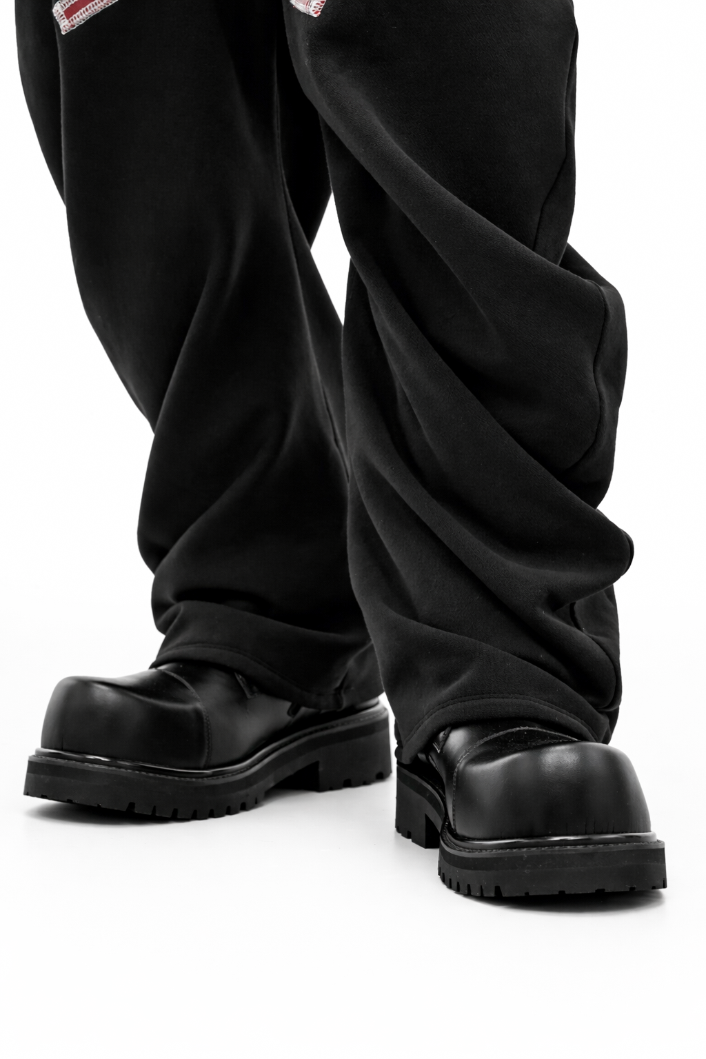 BLACK TWISTED TRACK PANTS